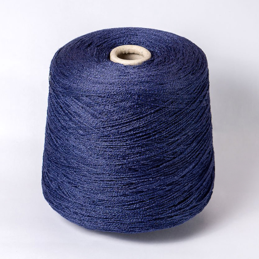 Skein of blue yarn on a white background. Material for the manufacture of knitwear. Side view.Textile reel on isolated white background.